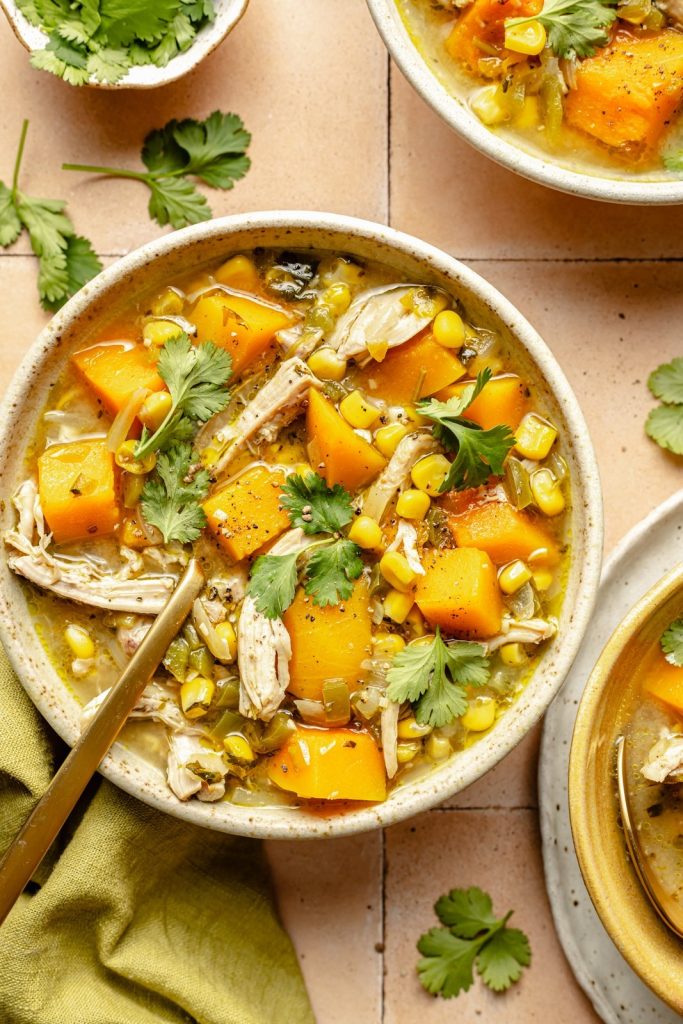 butternut squash green chile chicken soup in a bowl