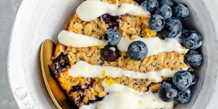 lemon blueberry oatmeal bake in a bowl with blueberries