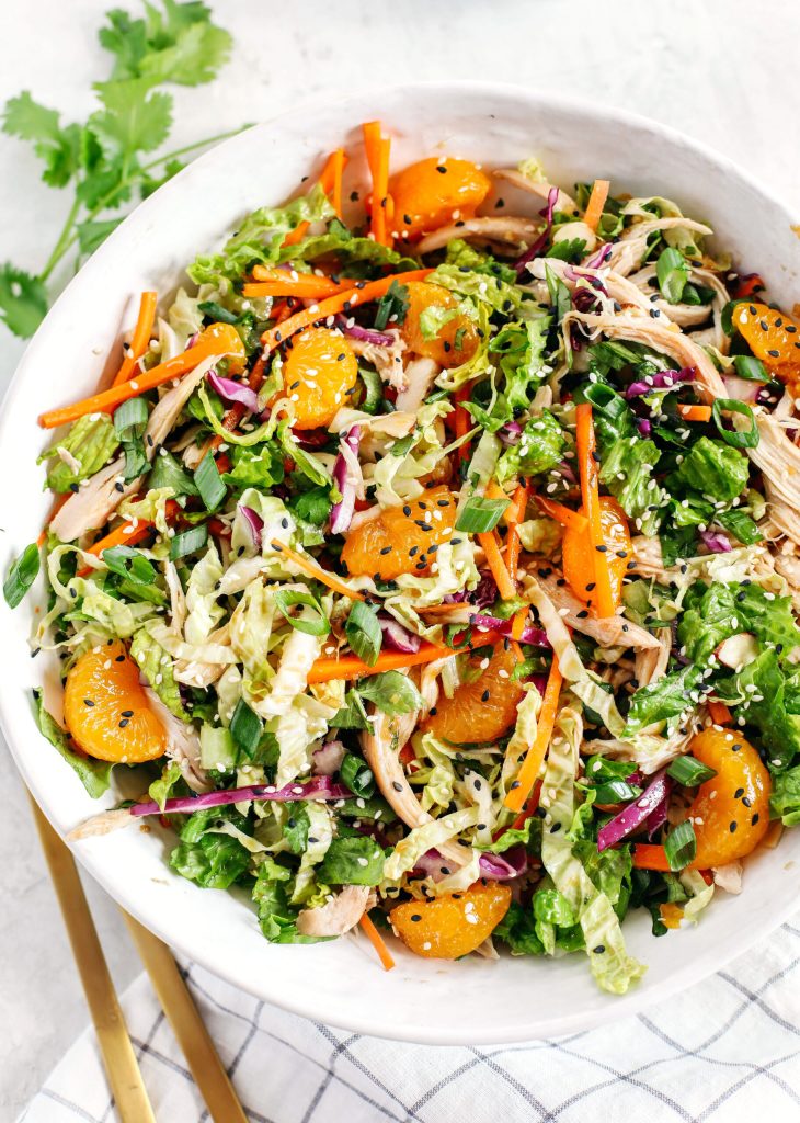 This Chinese Chicken Salad is loaded with fresh lettuce, cabbage, carrots, sweet mandarin oranges, crunchy almonds and cilantro all tossed together with a delicious ginger-sesame vinaigrette!