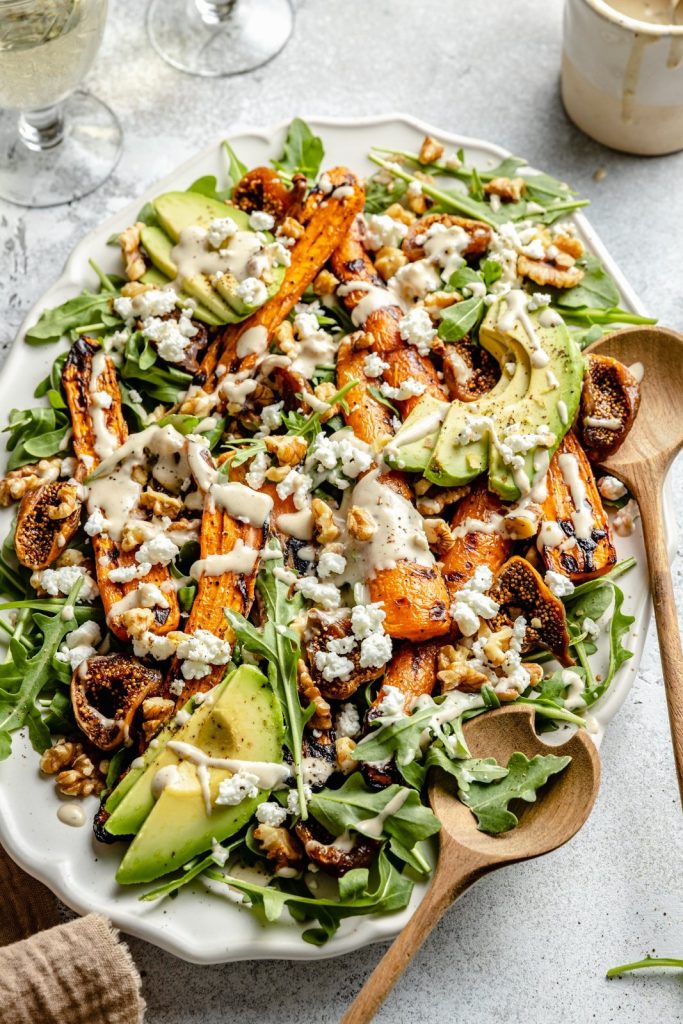 carrot arugula salad on a platter