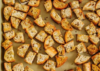 Learn how to make Easy Homemade Croutons that are crispy, garlicky and super quick to make!  Use them as a topping for salads, soups, stuffing and more!