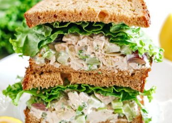 Healthy Chicken Salad made with tender chicken, Greek yogurt instead of mayo, crunchy celery, grapes, and sliced almonds for a delicious spin on a classic favorite!