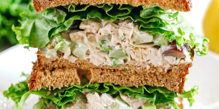 Healthy Chicken Salad made with tender chicken, Greek yogurt instead of mayo, crunchy celery, grapes, and sliced almonds for a delicious spin on a classic favorite!