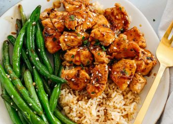 Super flavorful Honey Garlic Chicken and Green Beans make the perfect weeknight meal smothered in a delicious sauce that tastes way better than take-out!  Serve over rice and have dinner on your table in under 30 minutes! 