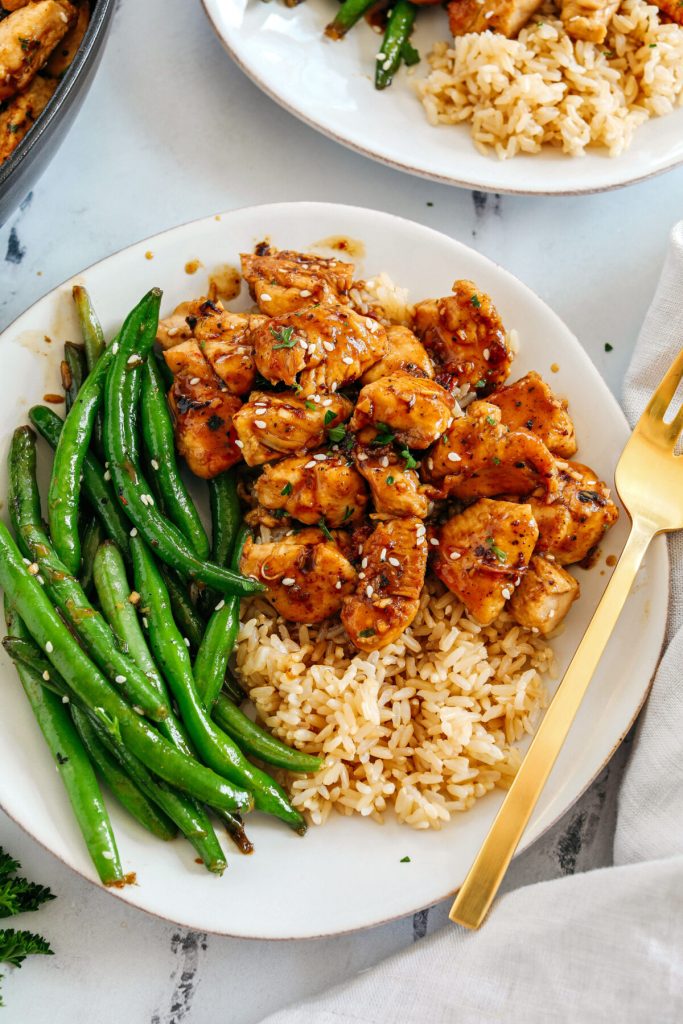 Super flavorful Honey Garlic Chicken and Green Beans make the perfect weeknight meal smothered in a delicious sauce that tastes way better than take-out!  Serve over rice and have dinner on your table in under 30 minutes! 