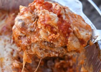 Spoonful of Dutch oven lasagna.