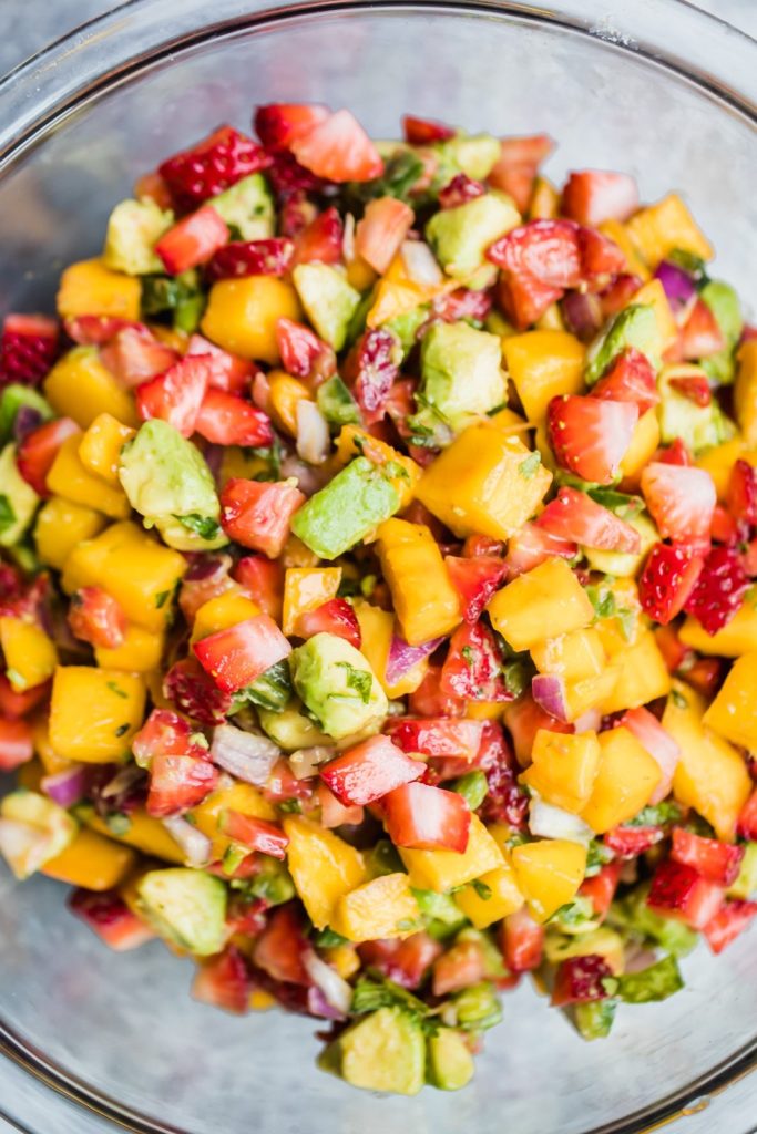 Avocado Strawberry Mango Salsa in a glass bowl