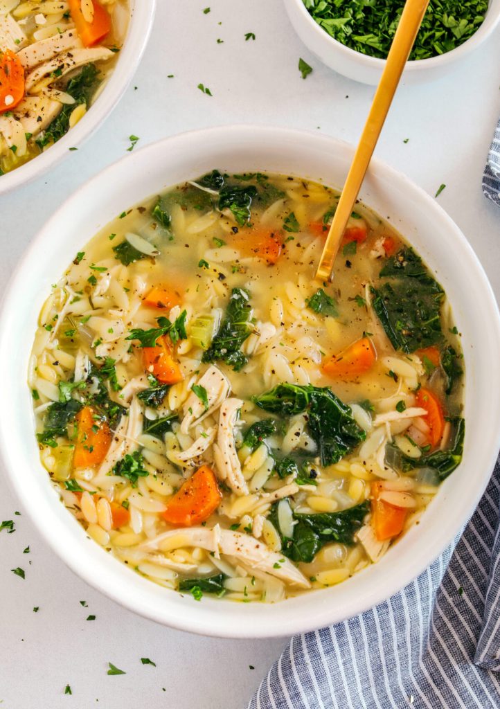 Easy and delicious Lemon Chicken Orzo Soup loaded with tender chicken, fresh veggies, and leafy greens all simmered in the most flavorful broth! Easily made in one pot for a cozy weeknight dinner the whole family will love!