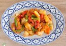 healthy sweet & sour sauce with chicken and vegetables on dinner plate