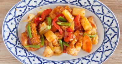 healthy sweet & sour sauce with chicken and vegetables on dinner plate