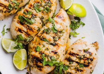 This Cilantro Lime Grilled Chicken Recipe is packed with so much zesty flavor and easily made with just a few simple ingredients! A delicious, healthy meal you can serve in tacos, on salads or over rice.