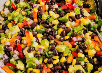 This Black Bean and Corn Salad is loaded with crisp veggies, delicious spices and fresh cilantro, all tossed together in a zesty lime dressing making it the perfect summer side dish or dip!