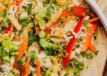 Fresh and crunchy Thai Chicken Salad filled with cabbage, bell peppers, carrots and cilantro all tossed together with a delicious ginger-sesame vinaigrette!