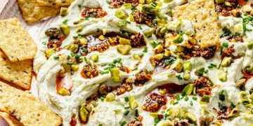 chili crisp honey cheese dip in a platter with crackers