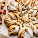 snowflake cinnamon roll on parchment paper